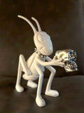 The Noisy Cricket White sculpture by Marcos Cojab resin and silver plated skull