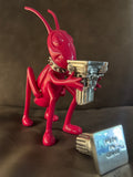 The Noisy Cricket Mexican Pink sculpture by Marcos Cojab resin silver plated column