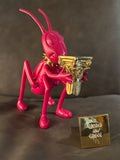 The Noisy Cricket Mexican Pink sculpture by Marcos Cojab resin 24K gold plated column