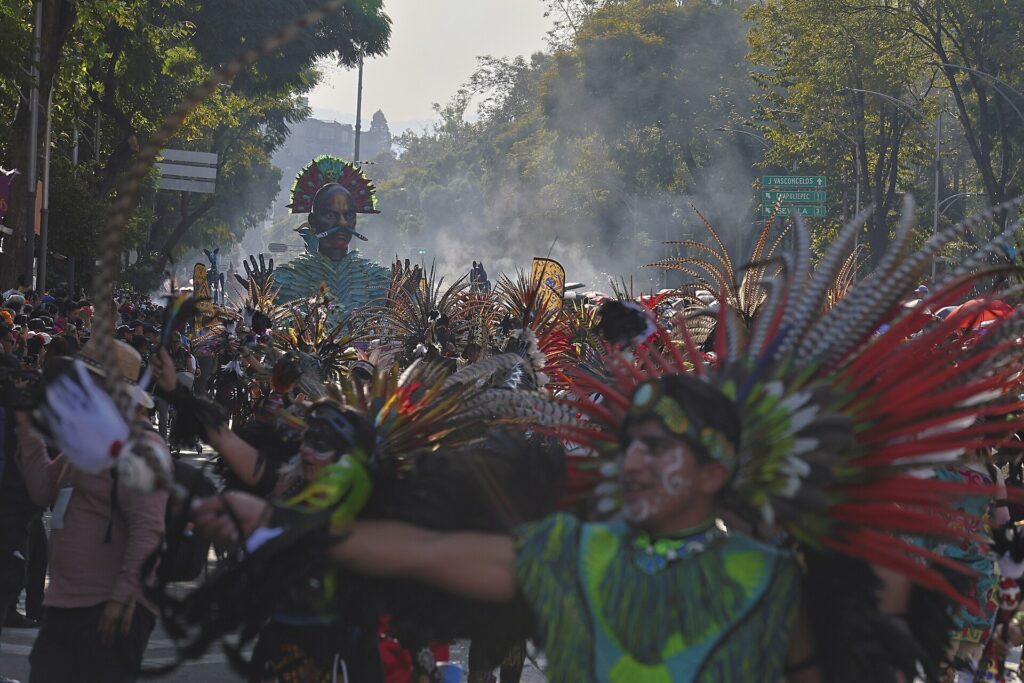 Dancers in feathered headdresses at the Day of the Dead parade in Mexico City, 2023